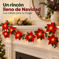 Guirnalda de flores de Pascua iluminada en la repisa de la chimenea
